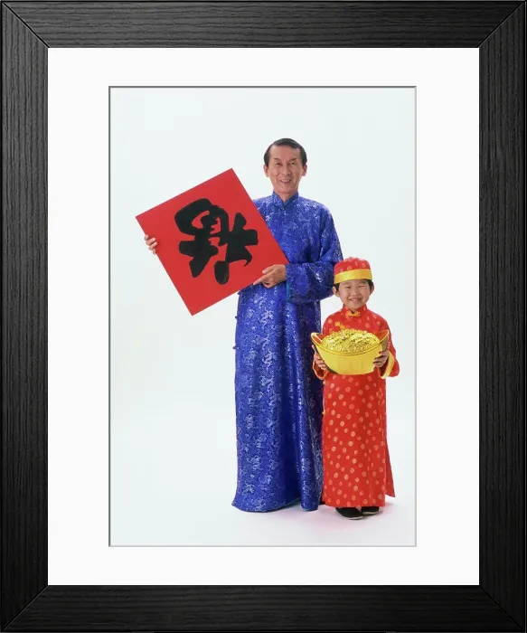 Framed Print : Portrait of a mid adult man holding a poster and a pot of gold with his son Framed Print : Portrait of a mid adult man holding a poster and a pot of gold with his son