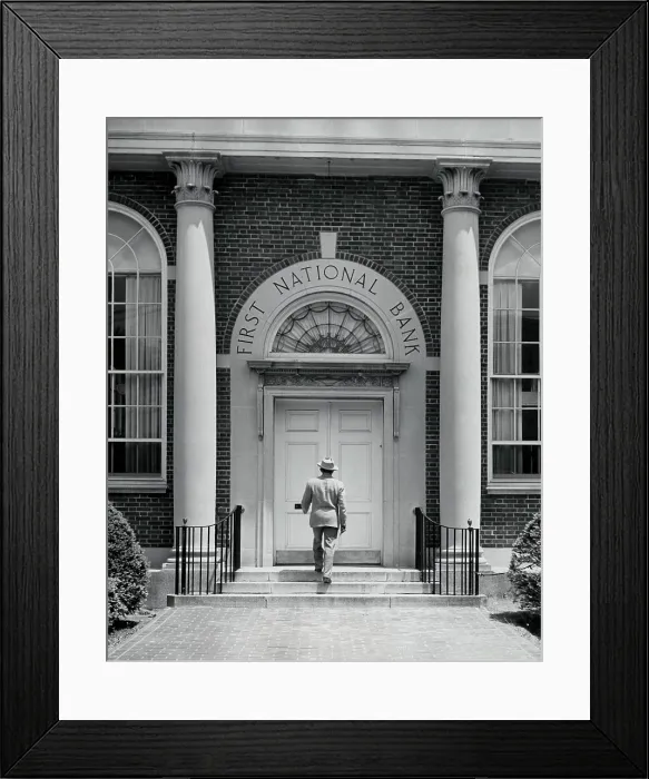 Framed Print : Rear view of a man entering a bank Framed Print : Rear view of a man entering a bank