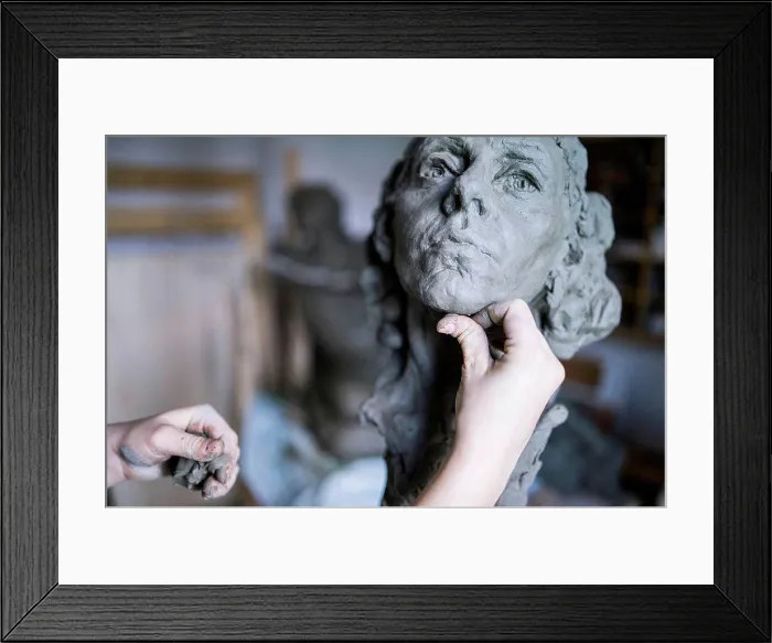 Framed Print : Female student forming chin of bust Framed Print : Female student forming chin of bust