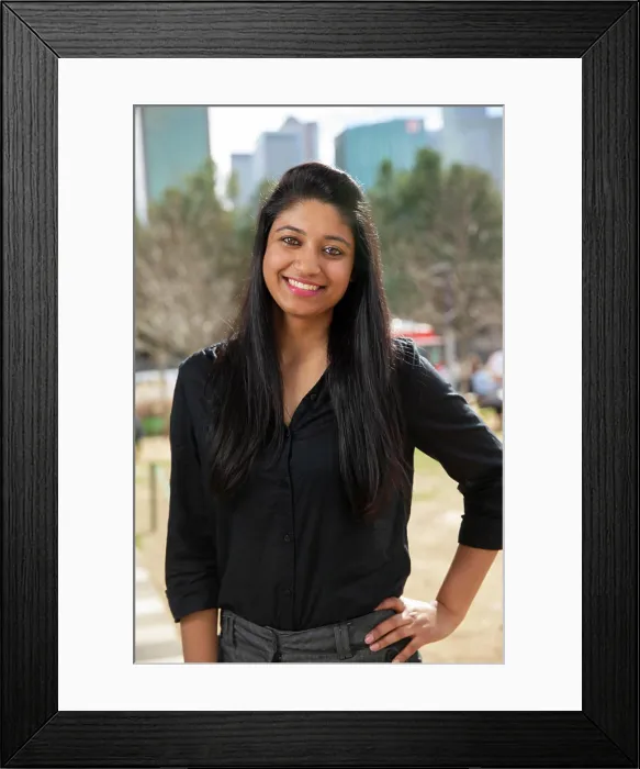 Framed Print : Smiling portrait of young ethnic woman with long black hair standing in park wearing black blouse Framed Print : Smiling portrait of young ethnic woman with long black hair standing in park wearing black blouse