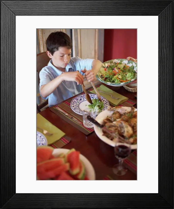 Framed Print : High angle view of a boy sitting at a dining table Framed Print : High angle view of a boy sitting at a dining table
