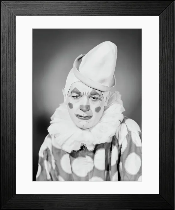 Framed Print : Studio portrait of sad clown
