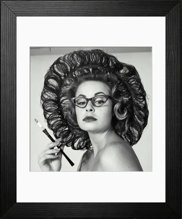 Framed Print : Close-up of a young woman holding a cigarette holder Framed Print : Close-up of a young woman holding a cigarette holder