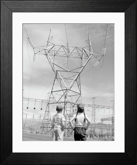 Framed Print : Boy and girl looking at electricity pylon Framed Print : Boy and girl looking at electricity pylon