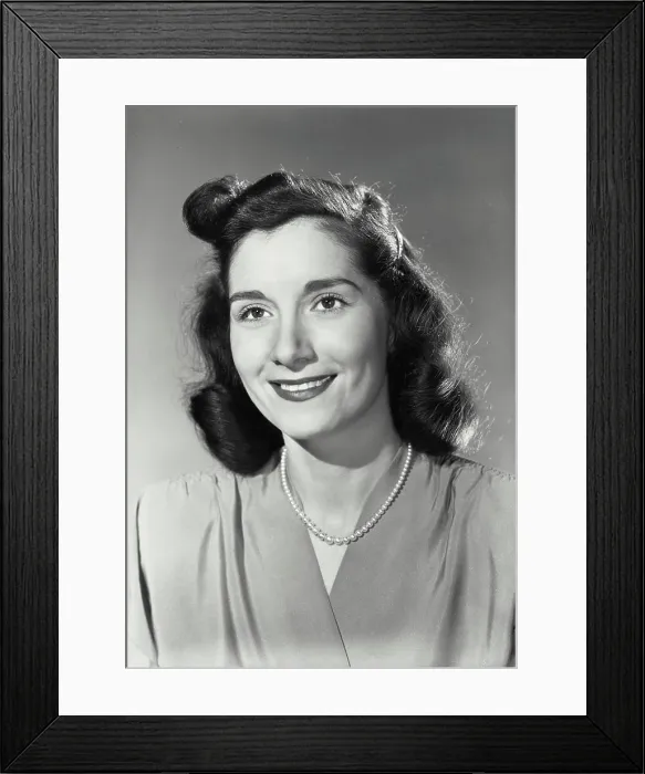Framed Print : Vintage Photograph. Smiling brunette woman wearing blouse and beaded necklace Framed Print : Vintage Photograph. Smiling brunette woman wearing blouse and beaded necklace