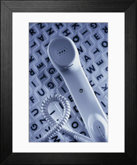 Framed Print : Telephone receiver on alphabets Framed Print : Telephone receiver on alphabets
