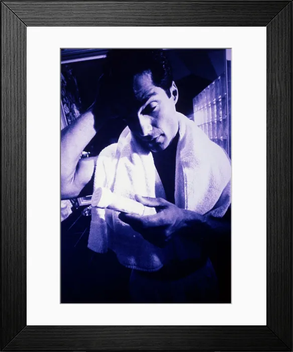 Framed Print : Young man holding a pill bottle Framed Print : Young man holding a pill bottle