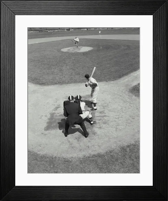 Framed Print : Pitcher winds up to throw a pitch to batter at home base, viewed from behind Framed Print : Pitcher winds up to throw a pitch to batter at home base, viewed from behind