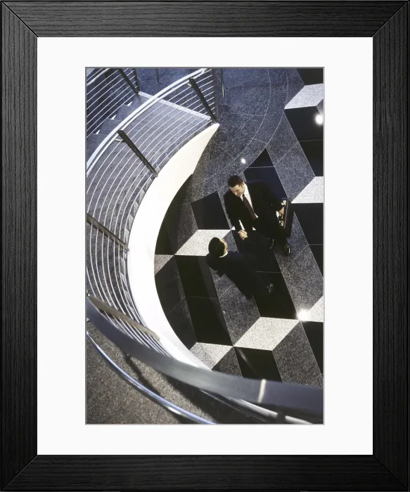 Framed Print : High angle view of two businessmen shaking hands Framed Print : High angle view of two businessmen shaking hands
