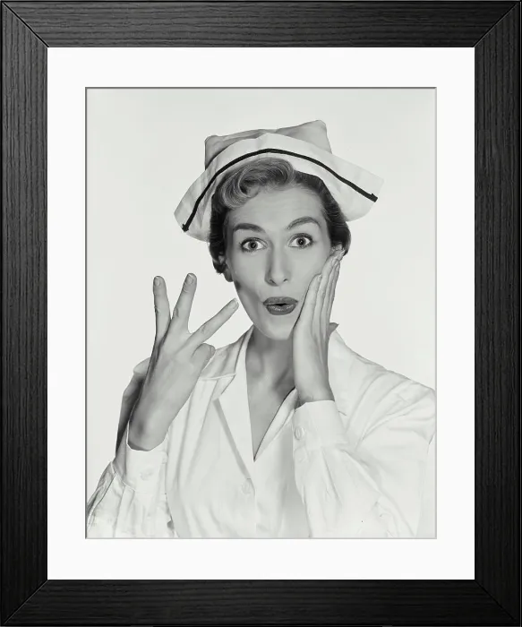 Framed Print : Vintage Photograph. Woman wearing nurse uniform holding up three fingers on right hand