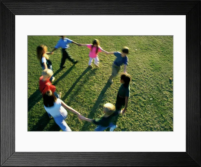 Framed Print : High angle view of a group of children playing on a lawn Framed Print : High angle view of a group of children playing on a lawn
