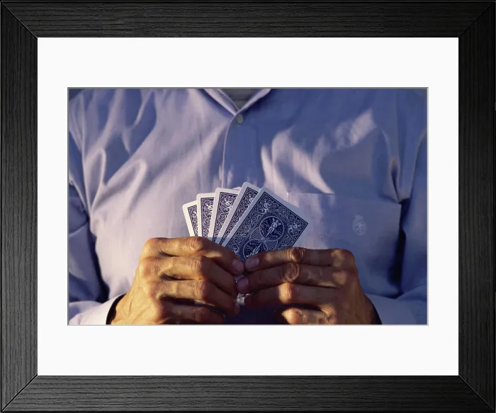 Framed Print : Mid section view of a man holding playing cards Framed Print : Mid section view of a man holding playing cards