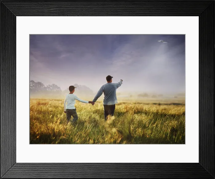 Framed Print : Back, alien and flying spaceship with a family outdoor in nature together during invasion or ufo discovery Framed Print : Back, alien and flying spaceship with a family outdoor in nature together during invasion or ufo discovery