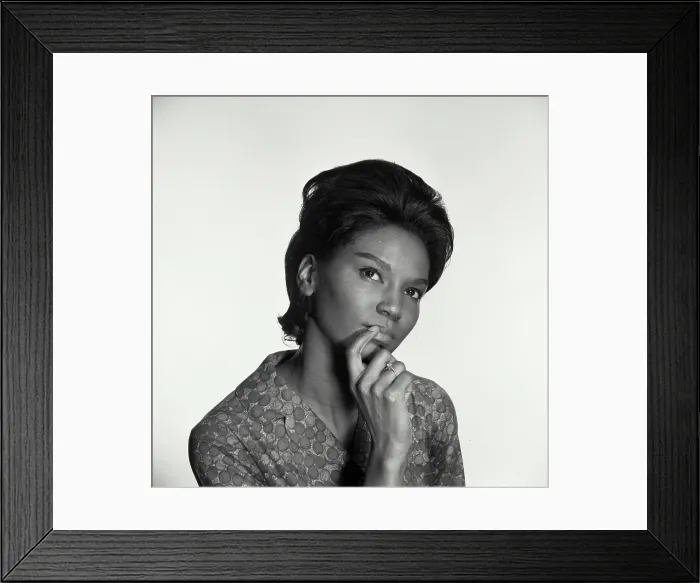 Framed Print : Close-up of a young woman thinking