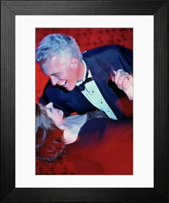 Framed Print : Close-up of a mid adult couple dancing Framed Print : Close-up of a mid adult couple dancing