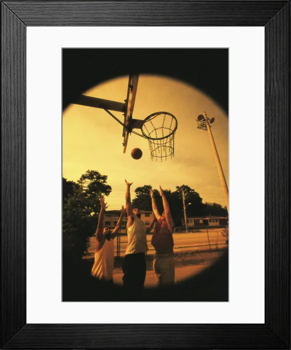 Framed Print : Three young men playing basketball