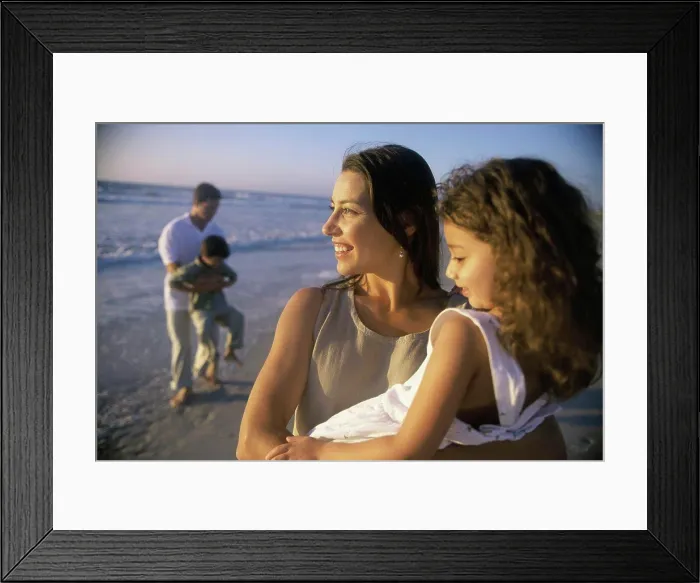 Framed Print : Young couple on the beach with their son and daughter Framed Print : Young couple on the beach with their son and daughter