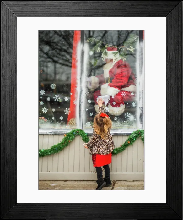 Framed Print : Toddler reaches for santa through window