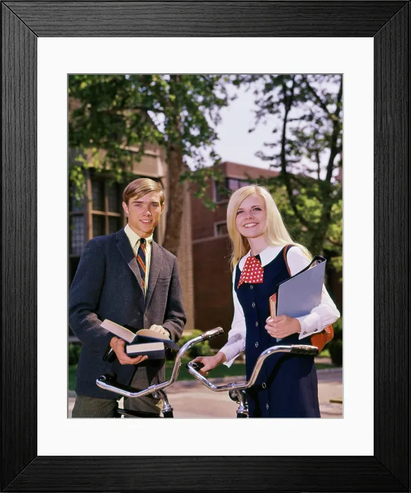 Framed Print : 1960s PORTRAIT STUDENT COUPLE ON CAMPUS WITH BIKES AND BOOKS LOOKING AT CAMERA Framed Print : 1960s PORTRAIT STUDENT COUPLE ON CAMPUS WITH BIKES AND BOOKS LOOKING AT CAMERA