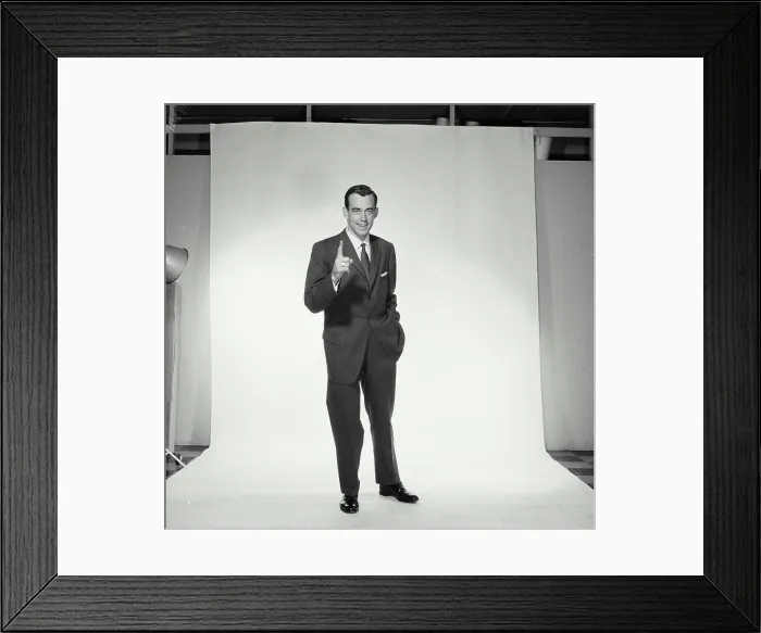 Framed Print : Portrait of businessman pointing upwards Framed Print : Portrait of businessman pointing upwards