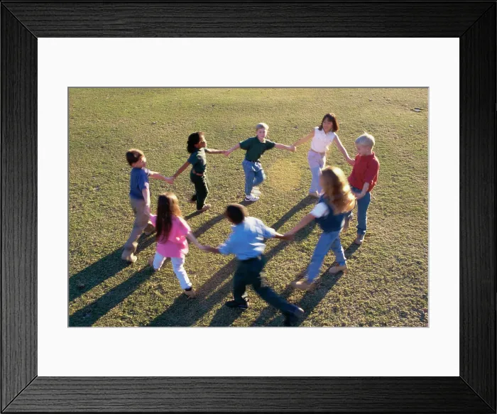 Framed Print : High angle view of a group of children playing ring-around-the-rosy Framed Print : High angle view of a group of children playing ring-around-the-rosy