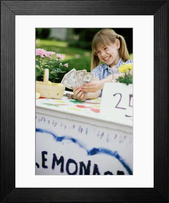 Framed Print : Girl making money at a lemonade stand Framed Print : Girl making money at a lemonade stand