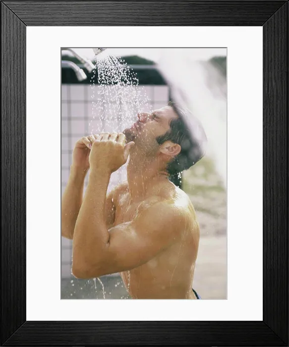 Framed Print : Side profile of a young man in the shower Framed Print : Side profile of a young man in the shower