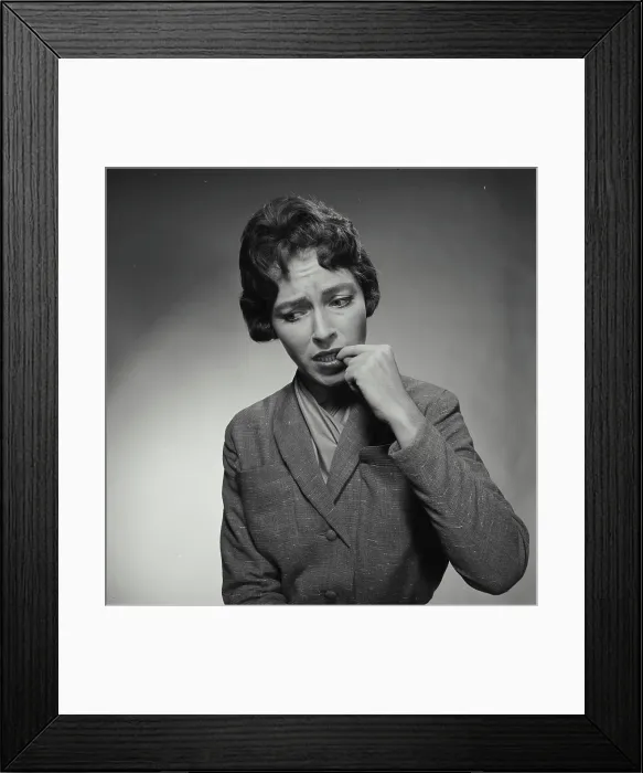 Framed Print : Close-up of a young worried woman Framed Print : Close-up of a young worried woman