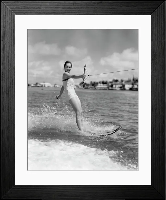 Framed Print : 1950S Smiling Woman In Bathing Suit Water Skiing Waving One Hand Framed Print : 1950S Smiling Woman In Bathing Suit Water Skiing Waving One Hand