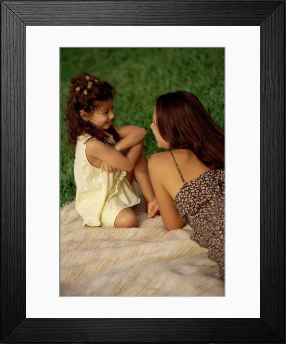Framed Print : High angle view of a mother talking to her daughter Framed Print : High angle view of a mother talking to her daughter