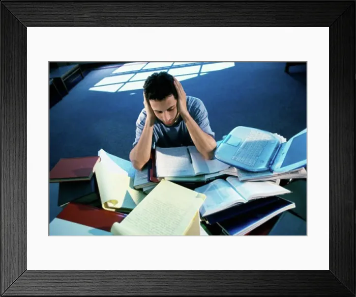 Framed Print : High angle view of a teenage boy studying Framed Print : High angle view of a teenage boy studying