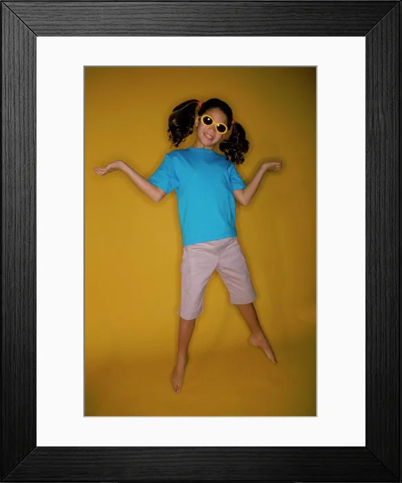 Framed Print : Close-up of a girl smiling