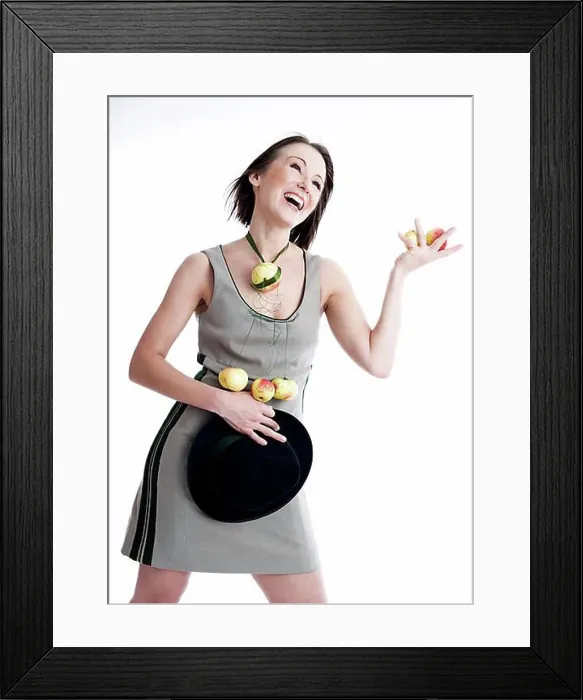 Framed Print : Young woman wearing a dress with organic apples Framed Print : Young woman wearing a dress with organic apples