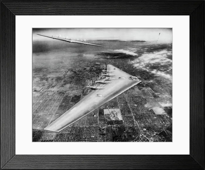 Framed Print : Shown here is an artist's conception of the Northrop Flying Wing XB-35 in flight over Los Angeles