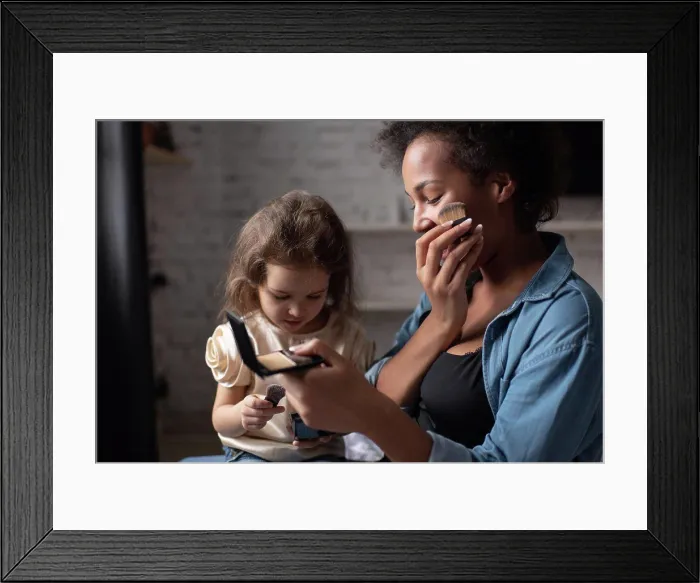 Framed Print : Ethnic woman showing daughter how to apply makeup Framed Print : Ethnic woman showing daughter how to apply makeup