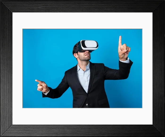 Framed Print : Businessman looking at data analysis while wearing VR glass and suit. Deviation