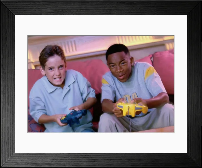 Framed Print : Portrait of two teenage boys playing video games Framed Print : Portrait of two teenage boys playing video games