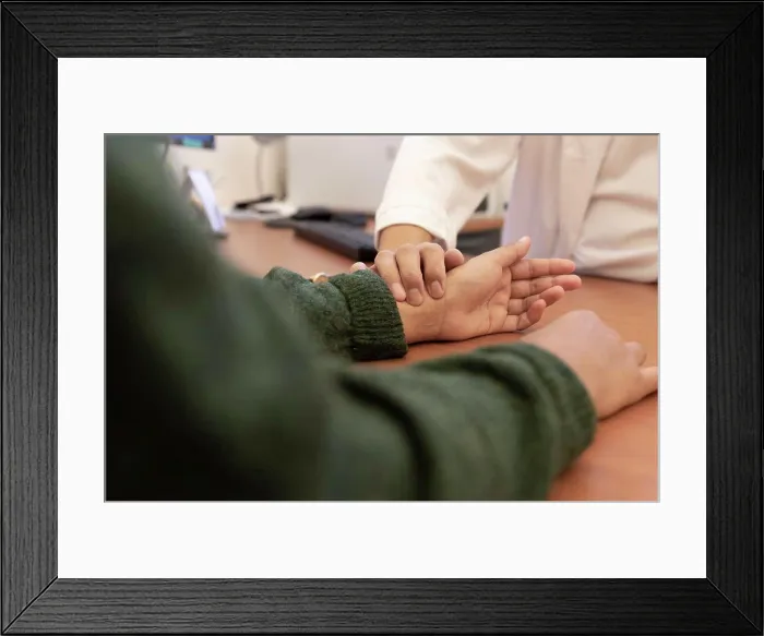 Framed Print : a doctor takes a patient's pulse on the wrist Framed Print : a doctor takes a patient's pulse on the wrist