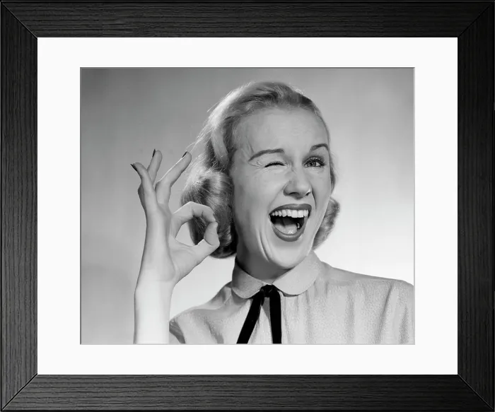 Framed Print : 1950S Blond Woman Winking Eye And Making Ok Sign With Thumb And Finger Framed Print : 1950S Blond Woman Winking Eye And Making Ok Sign With Thumb And Finger