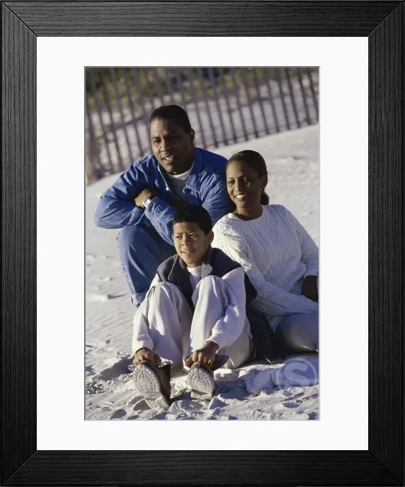 Framed Print : Mid adult couple on the beach with their son Framed Print : Mid adult couple on the beach with their son