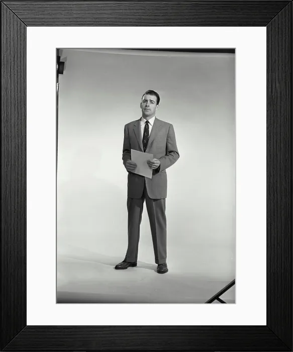 Framed Print : Vintage Photograph. Man in suit and tie holding sheet of paper on white background. Frame 1