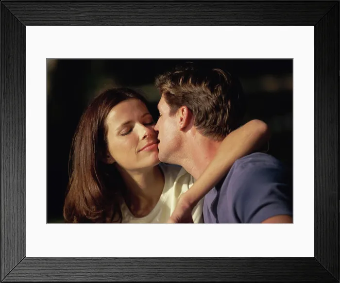 Framed Print : Close-up of a young couple looking at each other