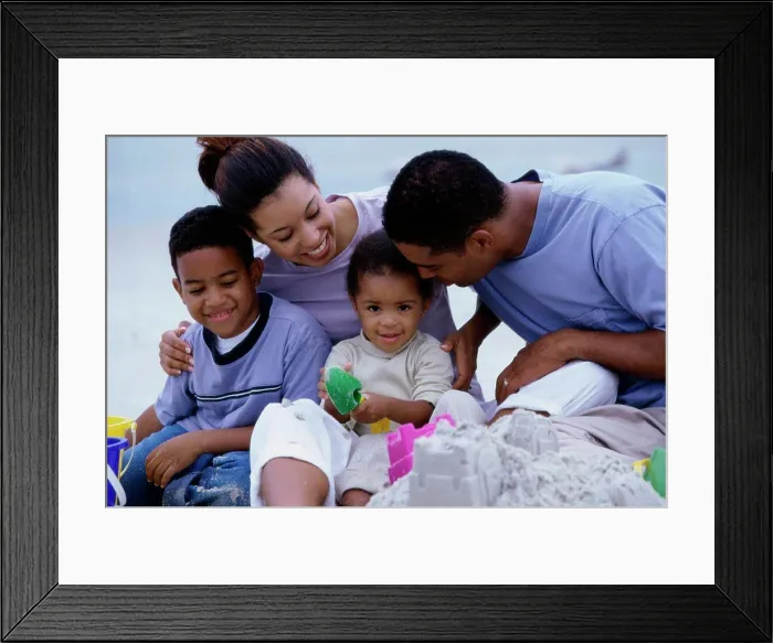 Framed Print : Parents with their son and daughter on the beach Framed Print : Parents with their son and daughter on the beach