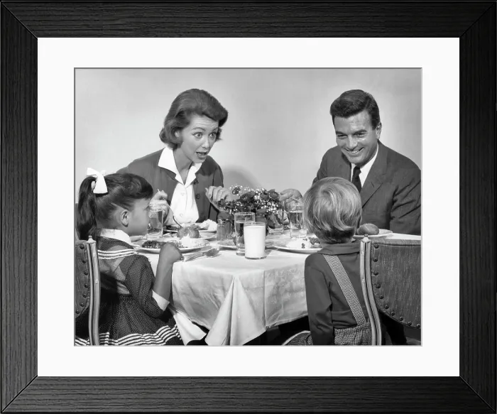 Framed Print : 1960s FAMILY OF FOUR EATING DINNER TOGETHER