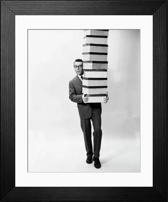 Framed Print : Portrait of a businessman carrying a stack of boxes