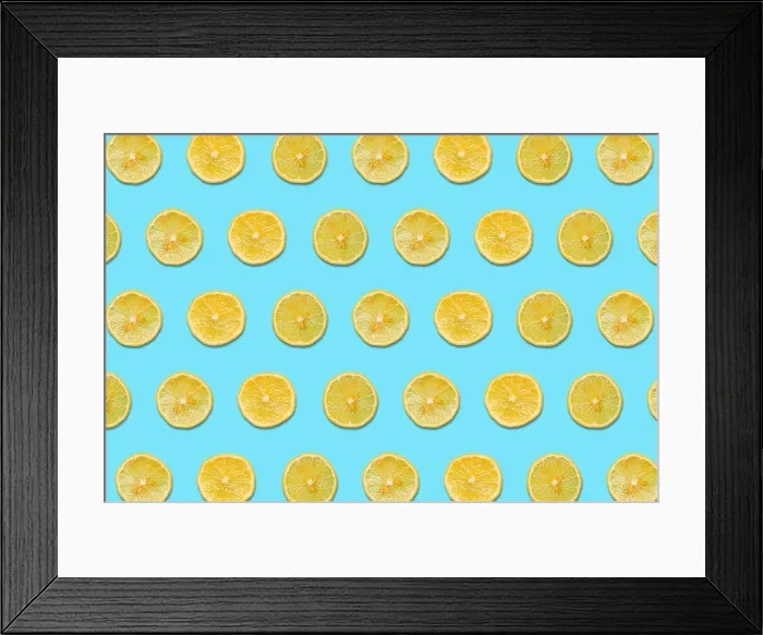 Framed Print : Lemon Slices on a Blue Background in a Pattern Framed Print : Lemon Slices on a Blue Background in a Pattern