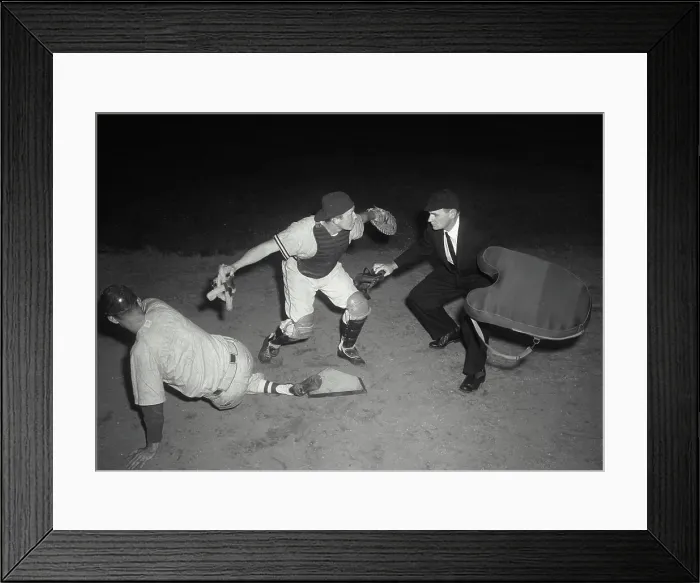 Framed Print : Baseball player sliding on home base and a umpire calling him safe Framed Print : Baseball player sliding on home base and a umpire calling him safe