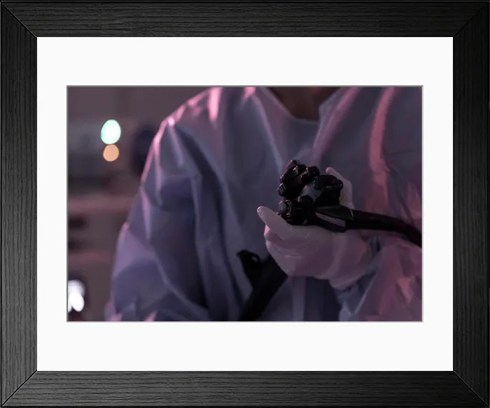 Framed Print : a gastroenterologist performs an endoscopy