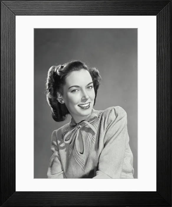 Framed Print : Pretty brunette woman wearing sweater blouse with tie on collar smiling Framed Print : Pretty brunette woman wearing sweater blouse with tie on collar smiling