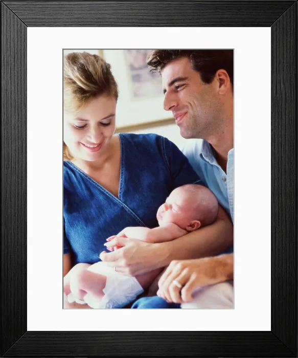 Framed Print : Close-up of parents holding their son